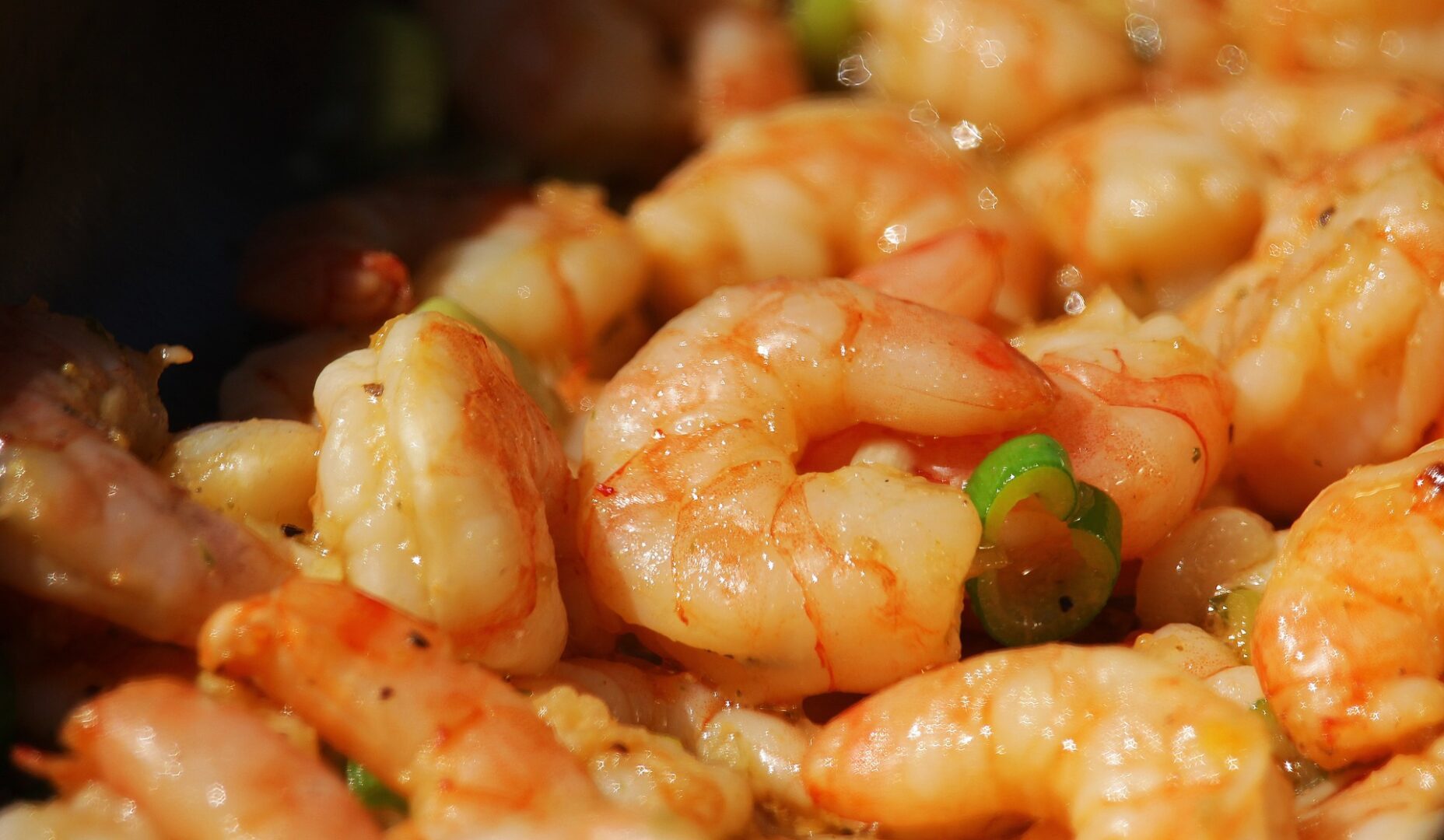 A close up of shrimp in sauce